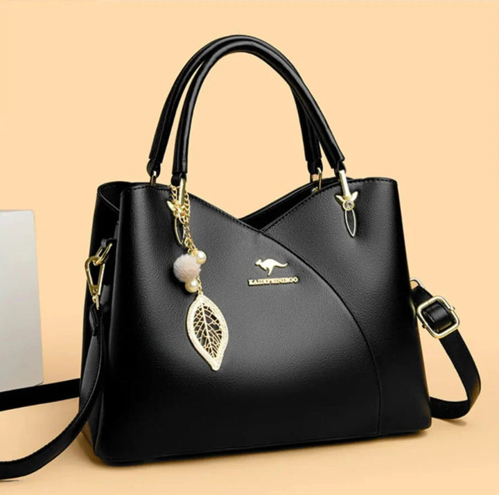 Felina™ - Elegancka czarna torebka na ramię z modnymi zawieszkami