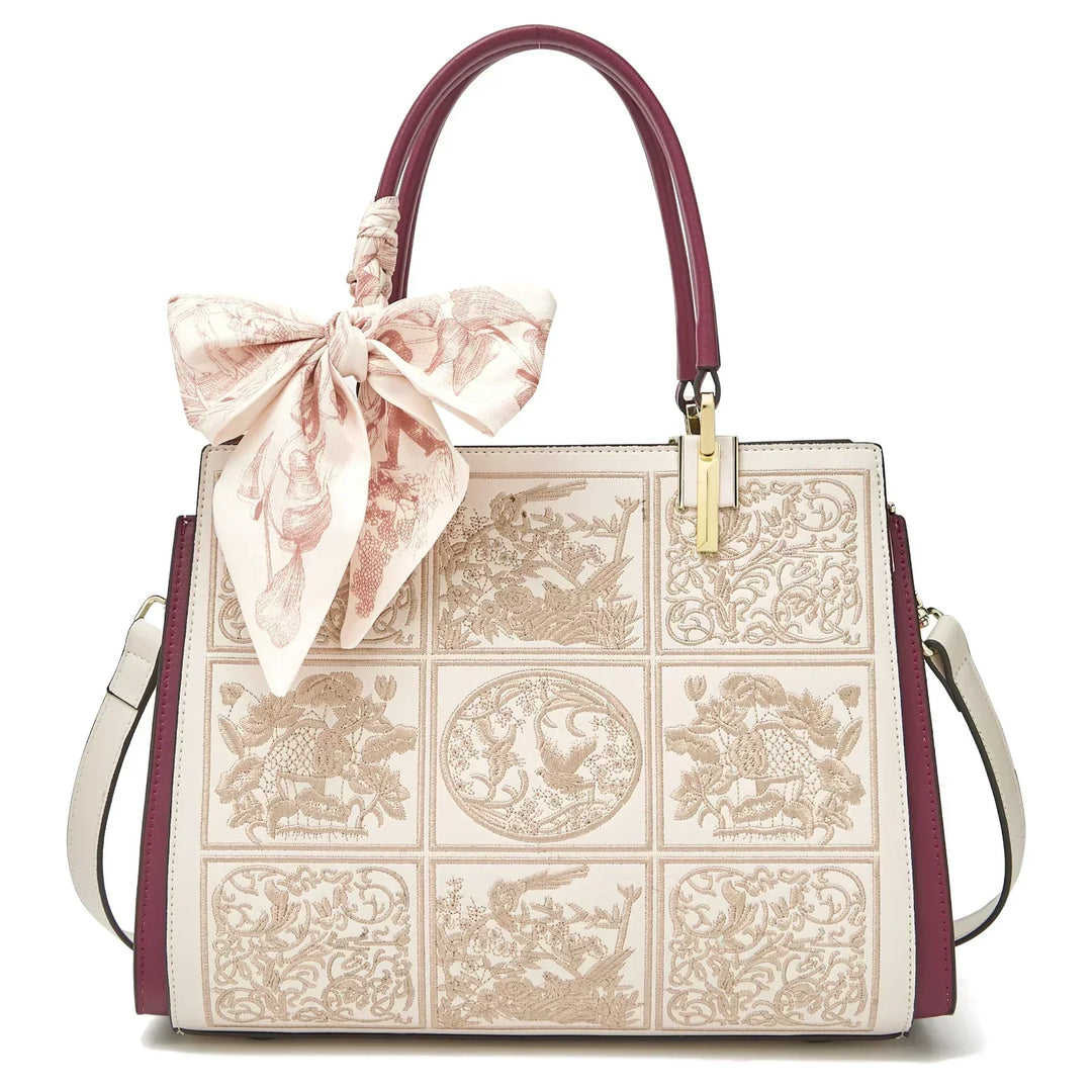Sylvia™ – Wyjątkowa torebka crossbody z haftem i kokardą